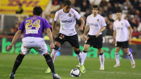 Valencia make do with point