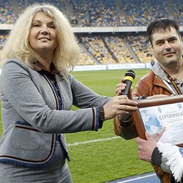 PILOT hands Dynamo season ticket owner trip voucher to Austria!